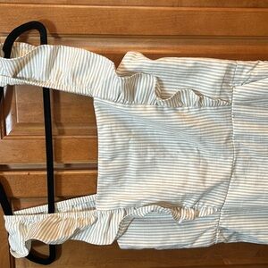 Ankle length tan and white striped jumpsuit with ruched back.